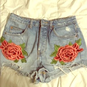 Rose appliqué denim shorts